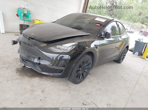 7SAYGDEE7PA135045 2023 TESLA MODEL Y Black Առջևի ձախ երեք քառորդ տեսարան