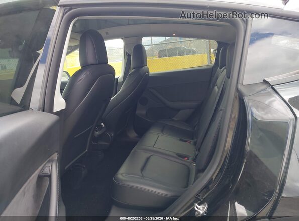 7SAYGDEE8NF455720 2022 TESLA MODEL Y Black VIN კოდის სტიკერის ხედი