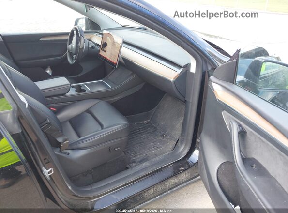 7SAYGDEE8PF949207 2023 TESLA MODEL Y Black Vista interior delantera