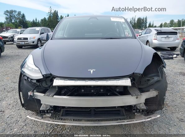 7SAYGDEEXPA157041 2023 TESLA MODEL Y Gray Widok wnętrza z tyłu