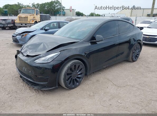 7SAYGDEF6RA304094 2024 TESLA MODEL Y Black წინა მარცხენა ხედი სამი მეოთხედიდან