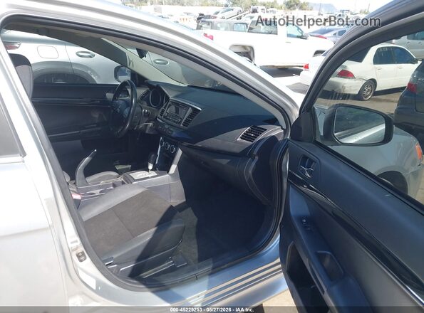 JA32U2FU7GU007841 2016 MITSUBISHI LANCER Silver Widok wnętrza z przodu