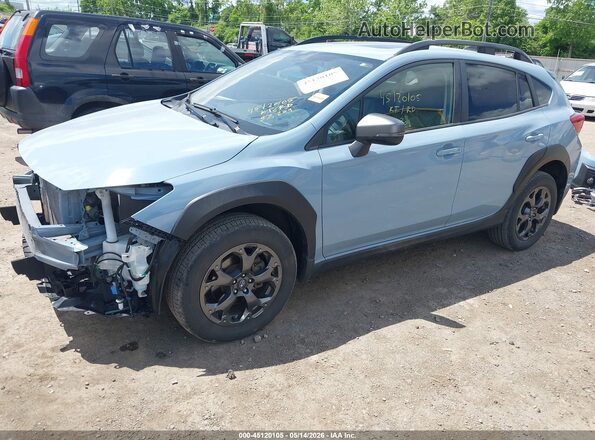 JF2GTHSC6NH207885 2022 SUBARU CROSSTREK Light Blue Vista tres cuartos delantera izquierda