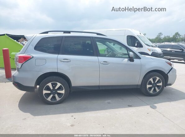 JF2SJAGC9HH571853 2017 SUBARU FORESTER Silver Rear interior view