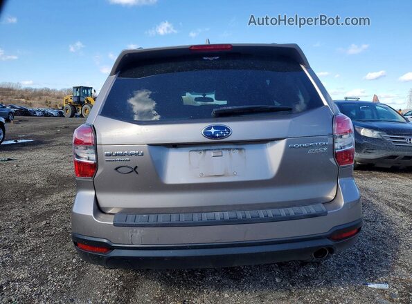 JF2SJAVC0GH458567 2016 SUBARU FORESTER Tan Rear view