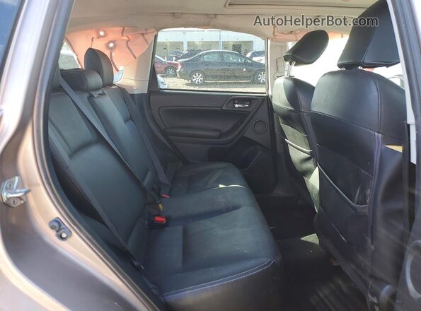 JF2SJAVC0GH458567 2016 SUBARU FORESTER Tan Rear interior view