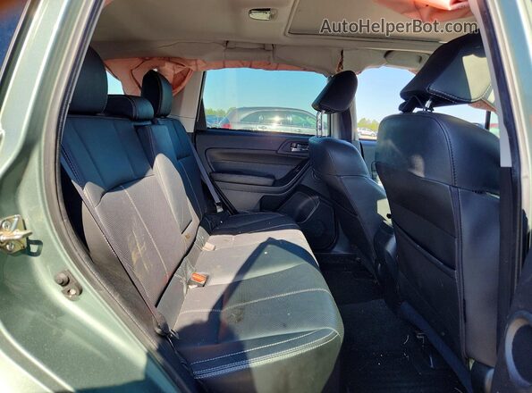 JF2SJAWC2JH402832 2018 SUBARU FORESTER Teal Vista interior trasera