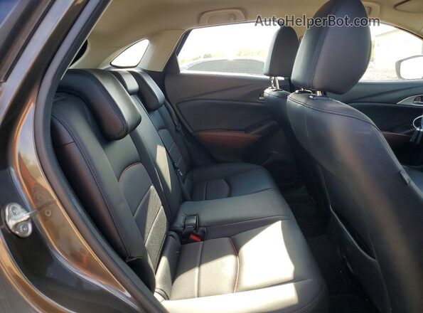 JM1DKFC70J0314059 2018 MAZDA CX-3 Gray Rear interior view