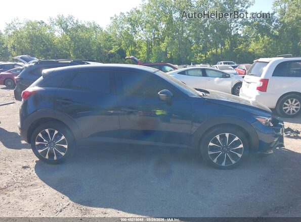 JM1DKFC7XK0414364 2019 MAZDA CX-3 Dark Blue Rear interior view