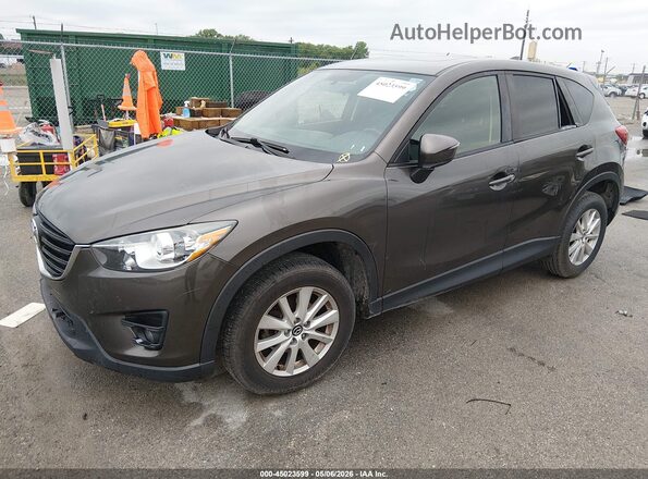 JM3KE2CY1G0849563 2016 MAZDA CX-5 Gray Vista tres cuartos delantera izquierda