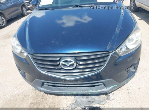 JM3KE2CY2G0764389 2016 MAZDA CX-5 Blue ხელსაწყოთა პანელის ხედი