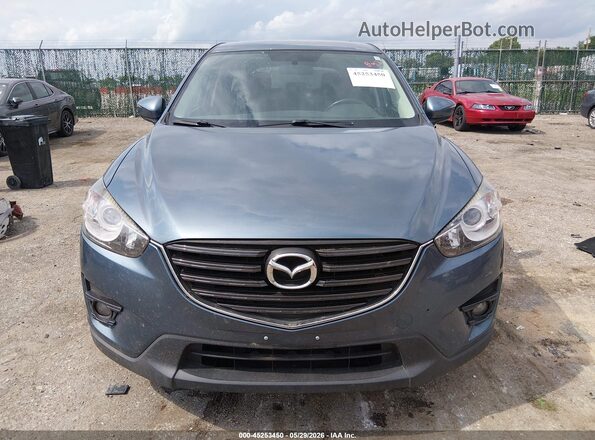 JM3KE2CY7G0919342 2016 MAZDA CX-5 Blue Rear interior view