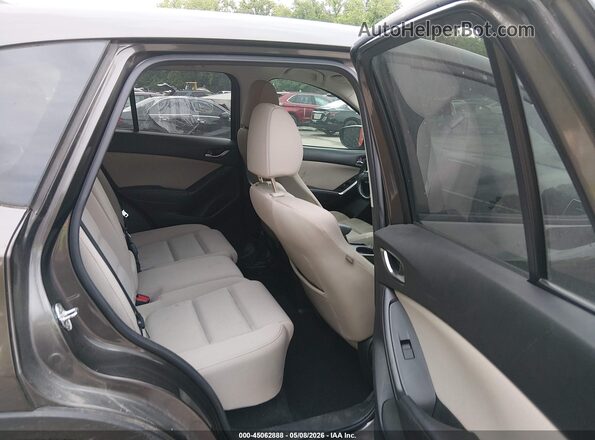 JM3KE2CY8G0725788 2016 MAZDA CX-5 Black VIN კოდის სტიკერის ხედი