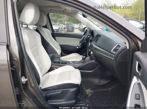 JM3KE4DY3G0670404 2016 MAZDA CX-5 Brown Вид салону спереду