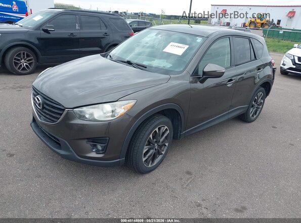 JM3KE4DYXG0809105 2016 MAZDA CX-5 Gray Vista tres cuartos delantera izquierda