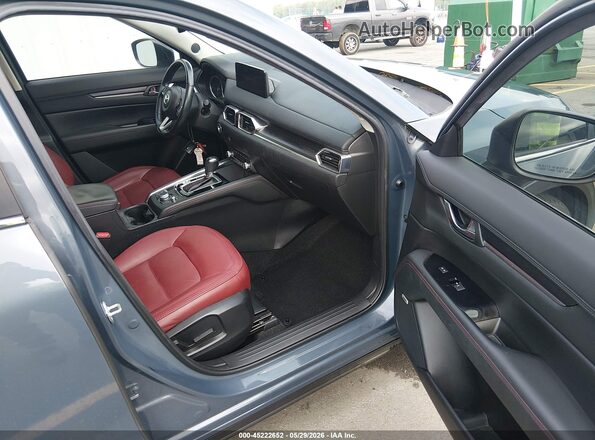 JM3KFACM4M0394353 2021 MAZDA CX-5 Blue Vista interior delantera