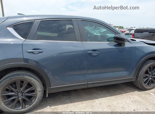 JM3KFBCM7N1582091 2022 MAZDA CX-5 Light Blue Vista interior trasera