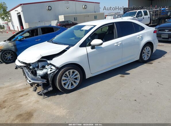 JTDBCMFE4T3131011 2026 TOYOTA COROLLA HYBRID White Vista tres cuartos delantera izquierda
