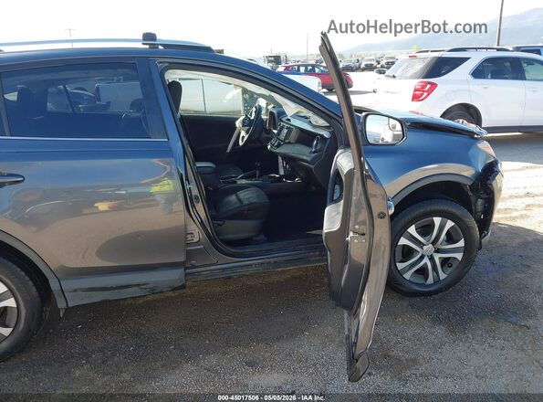 JTMBFREV9GD185670 2016 TOYOTA LE Gray Vista interior delantera
