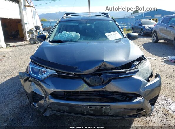 JTMBFREV9GD185670 2016 TOYOTA LE Gray Vista interior trasera