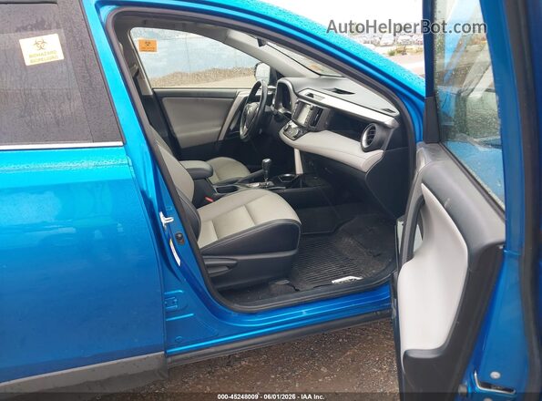 JTMDFREVXJJ218466 2018 TOYOTA RAV4 Blue Vista interior delantera