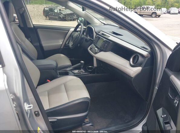 JTMDJREV6HD070596 2017 TOYOTA RAV4 HYBRID Silver Front interior view