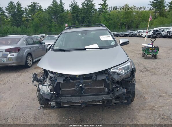 JTMDJREV6HD070596 2017 TOYOTA RAV4 HYBRID Silver Rear interior view