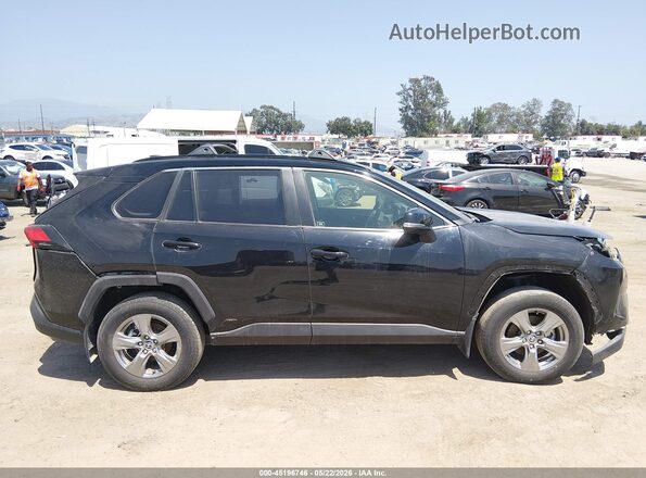 JTMMWRFV7RD219101 2024 TOYOTA RAV4 HYBRID Black Вид задньої частини салону