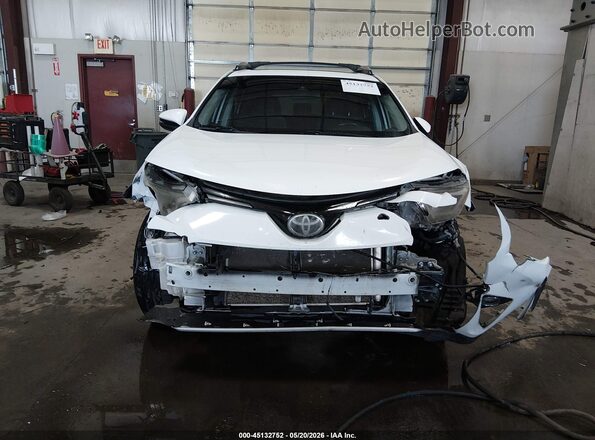 JTMRFREV7JJ189806 2018 TOYOTA RAV4 White Vista interior trasera