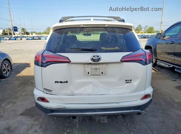 JTMRFREV9GJ068820 2016 TOYOTA RAV4 White Rear view