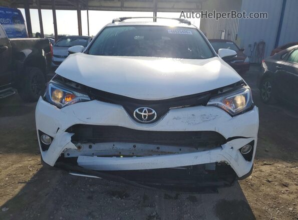 JTMRFREV9GJ068820 2016 TOYOTA RAV4 White Front view