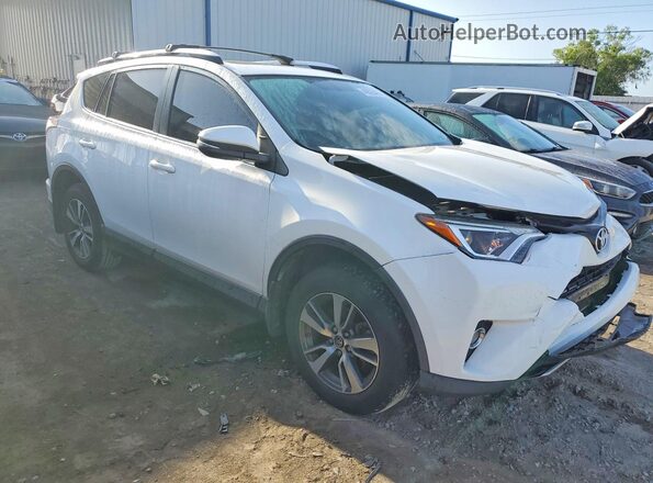 JTMRFREV9GJ068820 2016 TOYOTA RAV4 White Front right