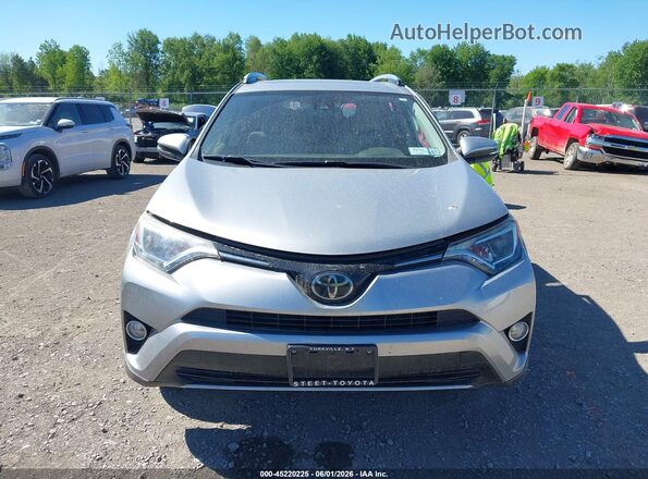 JTMRFREVXJJ223091 2018 TOYOTA RAV4 Silver Rear interior view