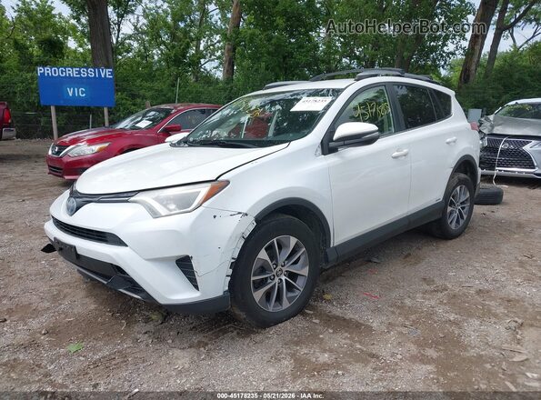 JTMRJREV9JD236749 2018 TOYOTA RAV4 HYBRID White Front left