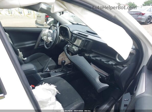 JTMRJREV9JD236749 2018 TOYOTA RAV4 HYBRID White Front interior view