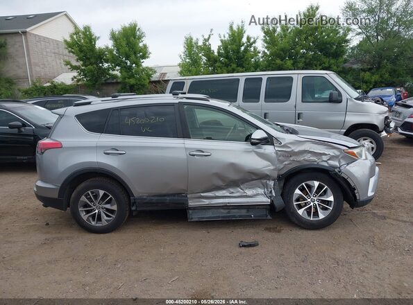 JTMRJREVXHD148254 2017 TOYOTA RAV4 HYBRID Silver Rear interior view