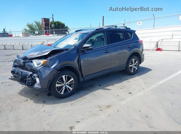 JTMWFREVXGJ068487 2016 TOYOTA RAV4 Gray Front left