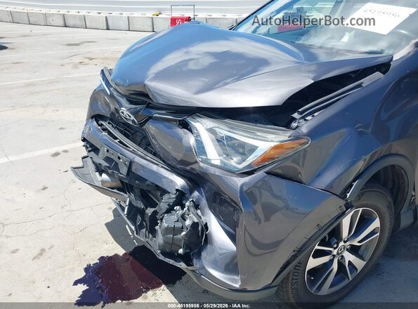 JTMWFREVXGJ068487 2016 TOYOTA RAV4 Gray Front view