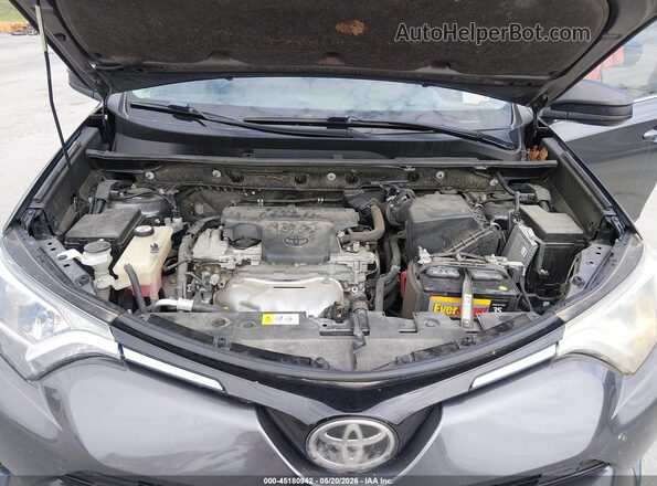JTMZFREV9HJ709031 2017 TOYOTA RAV4 Gray Rear view
