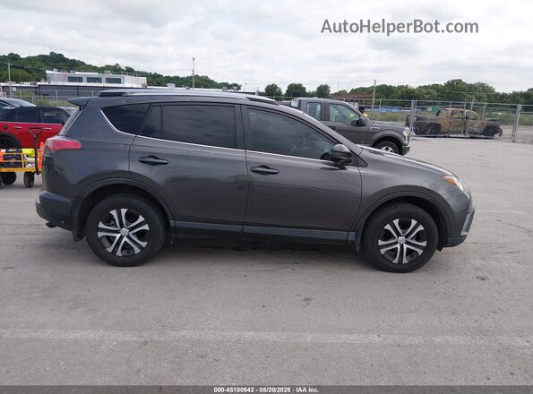 JTMZFREV9HJ709031 2017 TOYOTA RAV4 Gray Rear interior view