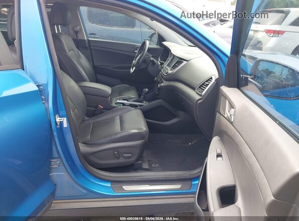 KM8J33A27GU140445 2016 HYUNDAI TUCSON Blue Widok wnętrza z przodu