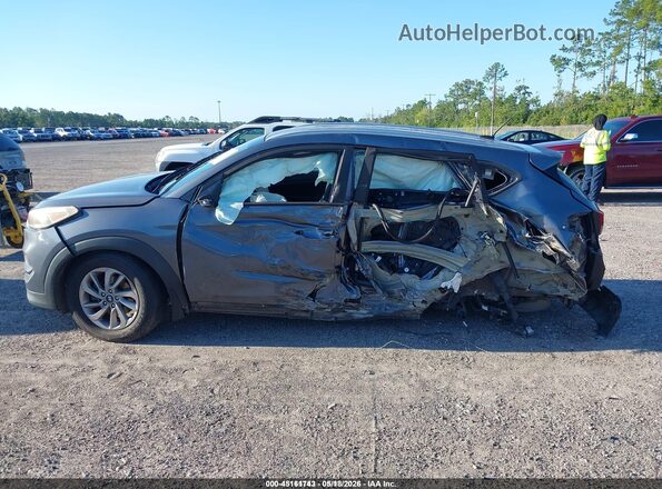 KM8J33A41GU208952 2016 HYUNDAI TUCSON Gray Widok wnętrza z tyłu