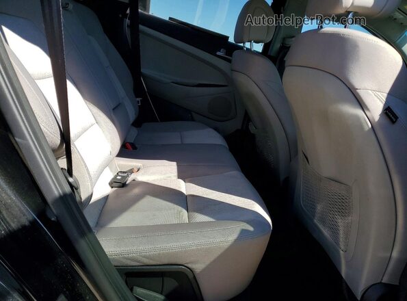 KM8J33A47GU204033 2016 HYUNDAI TUCSON Black Widok wnętrza z tyłu
