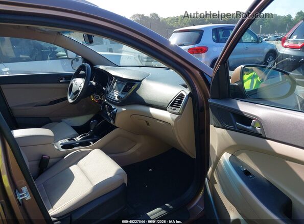 KM8J33A49GU185968 2016 HYUNDAI TUCSON Brown Вид салону спереду