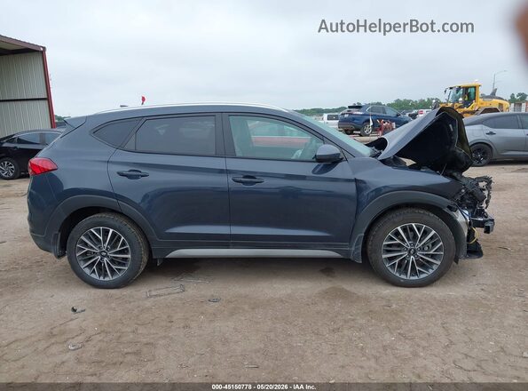 KM8J33AL2MU360581 2021 HYUNDAI TUCSON Blue Rear interior view
