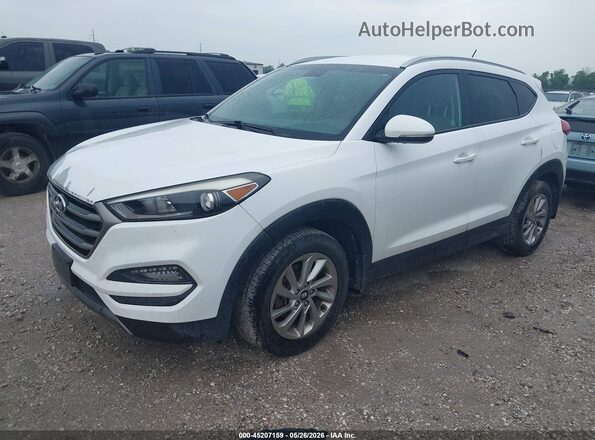 KM8J3CA24GU082908 2016 HYUNDAI TUCSON White წინა მარცხენა ხედი სამი მეოთხედიდან