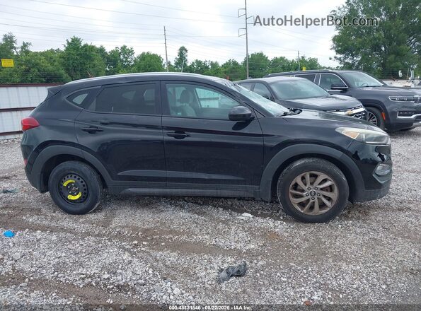 KM8J3CA40GU156875 2016 HYUNDAI TUCSON Черный Вид задней части салона