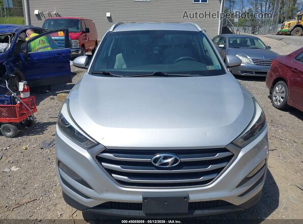 KM8J3CA40JU757212 2018 HYUNDAI TUCSON Silver უკანა სალონის ხედი