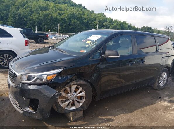 KNDMB5C14J6389320 2018 KIA SEDONA Black Front view