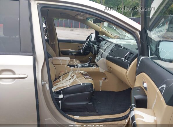 KNDMB5C16G6211434 2016 KIA SEDONA Tan Front interior view